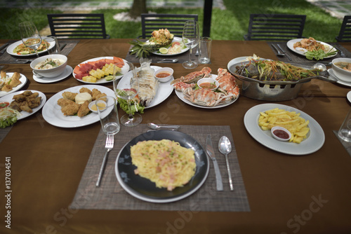 Delicious food set mixed full on the table in restaurant