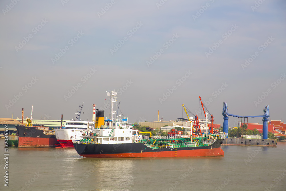 Logistic concept,Tanker Anchored mid-river to wait to port.