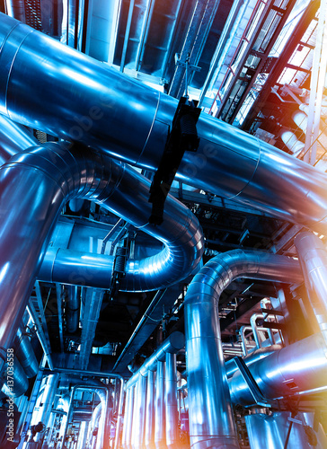 Industrial zone, Steel pipelines and valves in blue tones © Andrei Merkulov