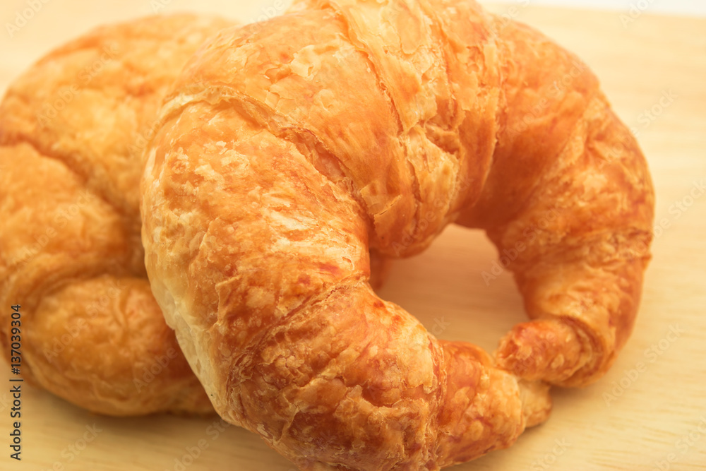 Tasty croissants on wooden background Tasty croissants on wooden background