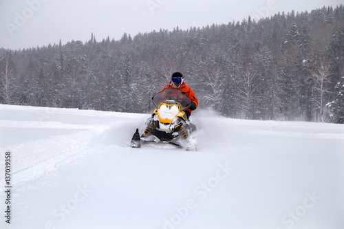 Athlete on a snowmobile