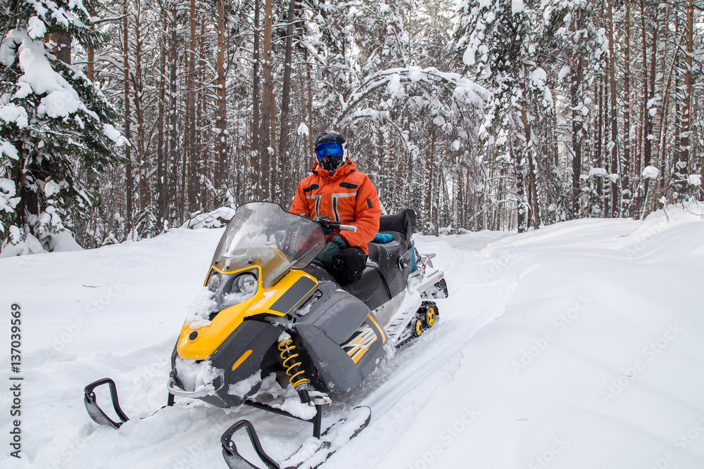 Athlete on a snowmobile