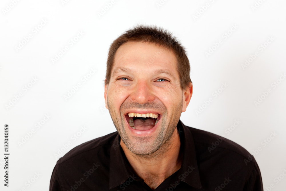 The young man laughs The young man laughs
