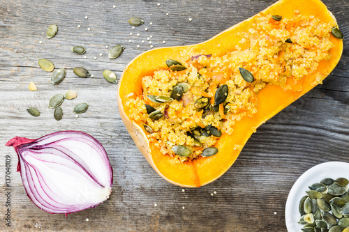 Top View Vegetarian Food. Quinoa with Pumpkin Seeds and Vegetable Mix in Butternut. Raw Ingredients on Wooden Table.