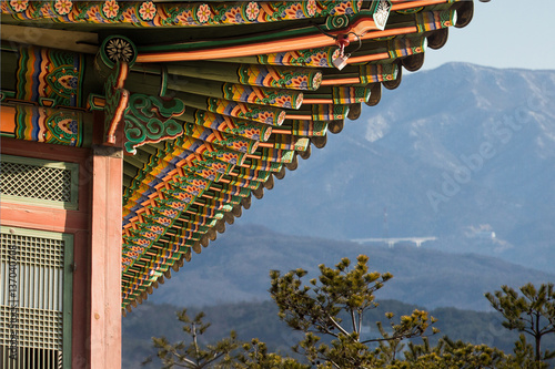 Traditional Korean building on a background of mountains photo