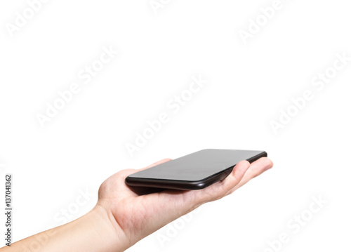 Fotografie Hand holding black mobile phone with blank screen isolated on wh