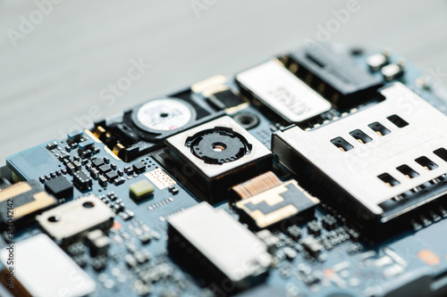 Disassembled parts of digital gadget closeup shot