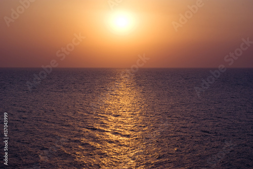 Sunset at the sea water surface