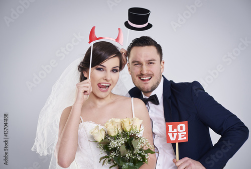 Bride and bridegroom making funny faces . photo