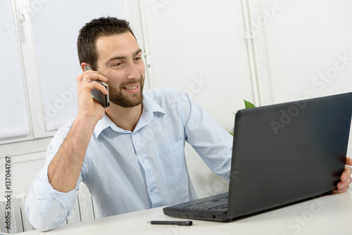 Portrait of a young businessman in his office