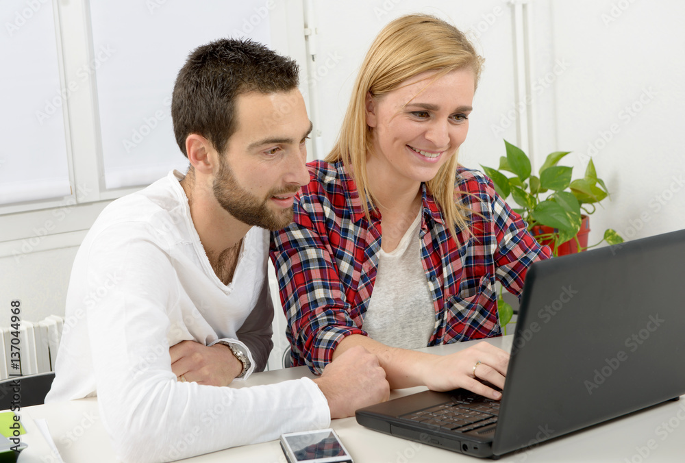 attractive man and woman business using laptop computer