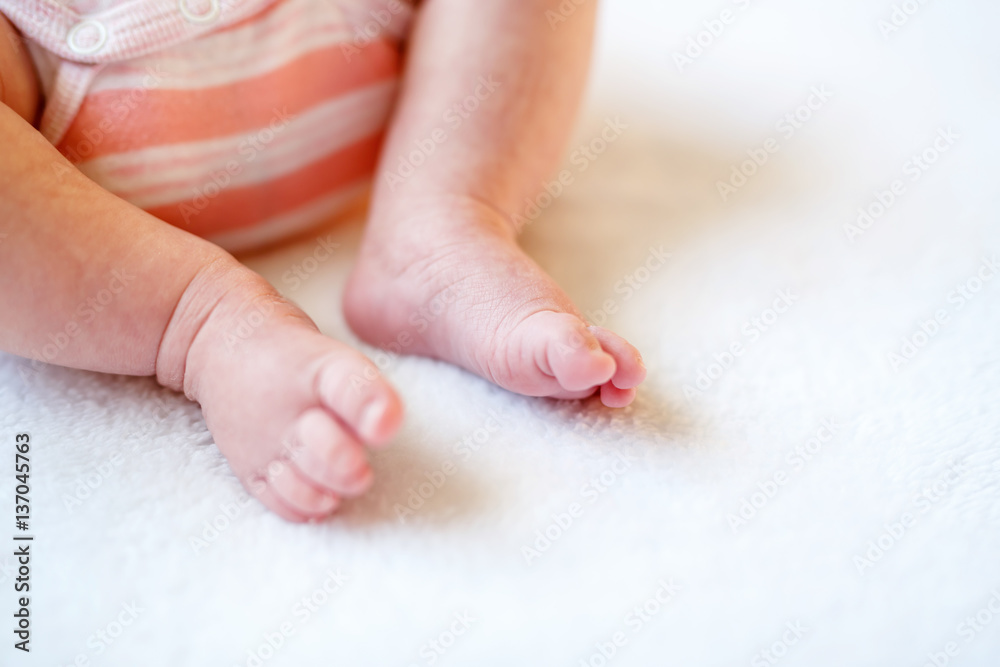 Close up of baby feet isolated on white background