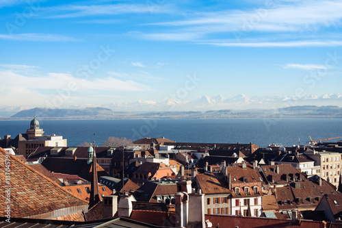 Top view of the medieval town of Neuchatel in Switzerland, on the horizon can be seen the lake and the Bernese Alps Chaumont. photo