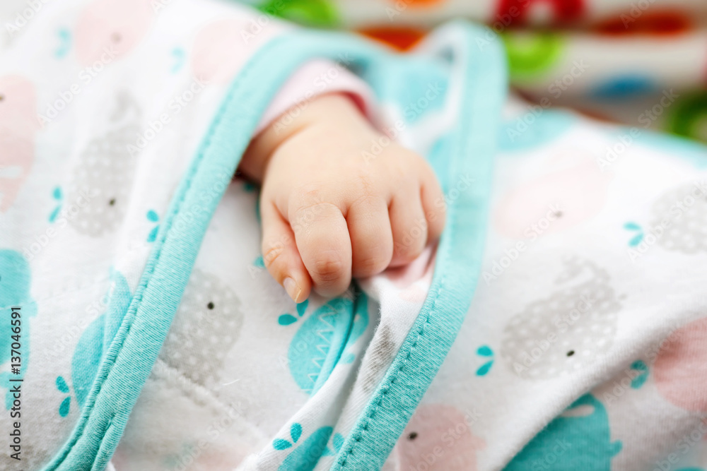 Close up of baby hand. Small fingers of newborn baby girl Close up of baby hand. Small fingers of newborn baby girl