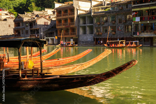 Photo of Ancient City Fenix in China. Historic Asian Scenery with Water Canals, Wooden Houses, Gondola Boats