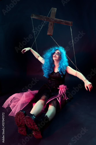 model with makeup in form of marionette doll on dark background