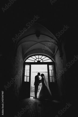 Young couple in an old house entrance