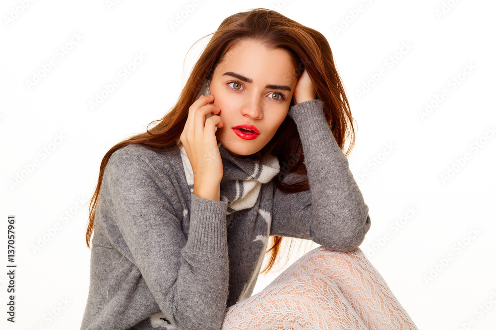 Portrait of young beautiful woman talking on the phone over whit Portrait of young beautiful woman talking on the phone over whit