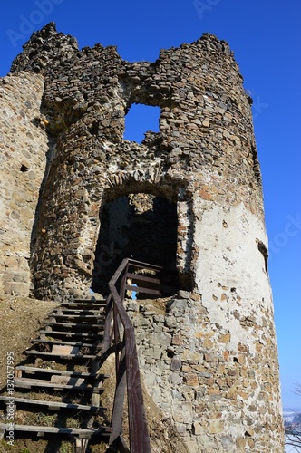 Ruins of round gothic tower on castle Reviste, central Slovakia photo