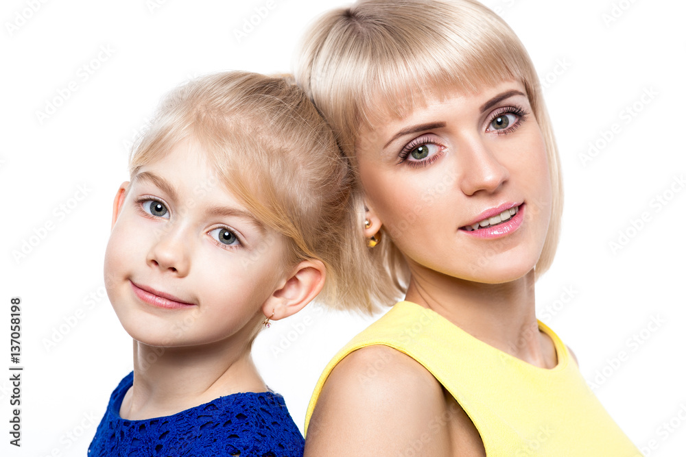 Mother and daughter in colorful dress on white background Mother and daughter in colorful dress on white background