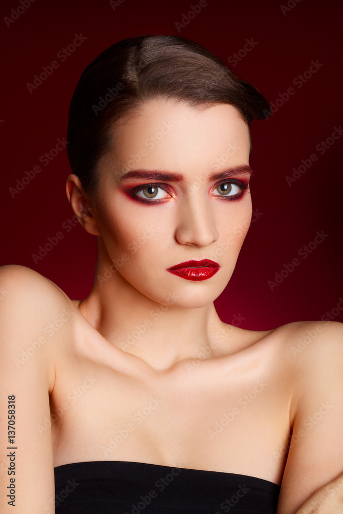 Portrait of beautiful sexy fashion model with red make up over r Portrait of beautiful sexy fashion model with red make up over r