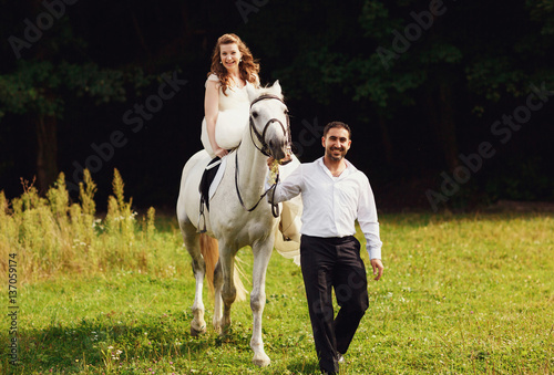Romantic riding a horse © myronovychoksana
