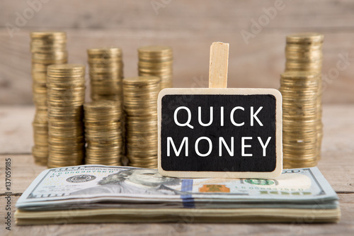 Wallpaper Mural Stacks of coins and dollar bills, blackboard with text "QUICK MONEY" Torontodigital.ca