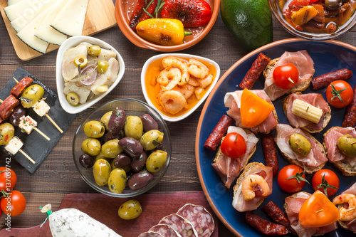 Spanish tapas starters on wooden table