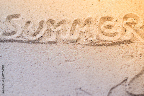 The inscription on the sand beach summer