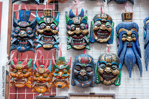 Wooden Chinese masks on sale at a souvenir market near Yu Garden  Shanghai