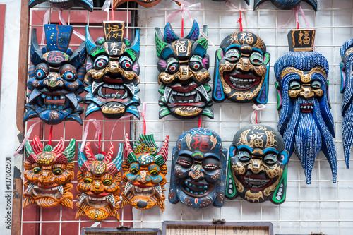 Canvas Print Wooden Chinese masks on sale at a souvenir market near Yu Garden, Shanghai
