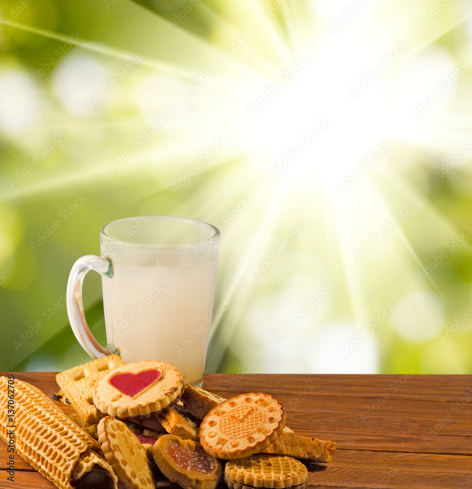 many delicious cookies and milk on the table close-up.