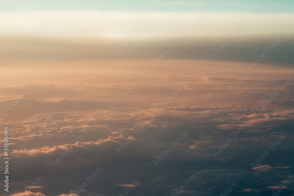 Thick soft clouds in hazy rosy air on idyllic sky