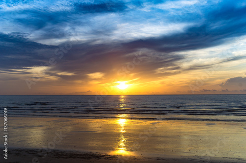 beautiful beach in the morning with clouds and reflection