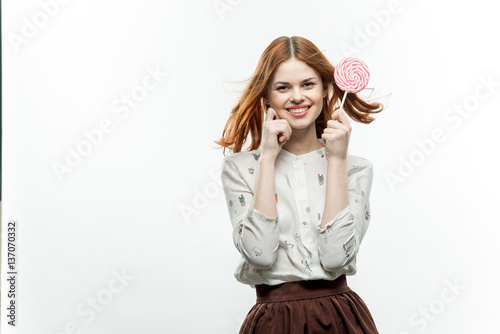 happy woman with lollipops on stick