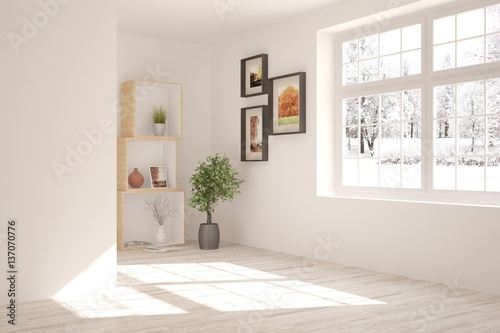 White empty room with shelf and winter landscape in window. Scandinavian interior design
