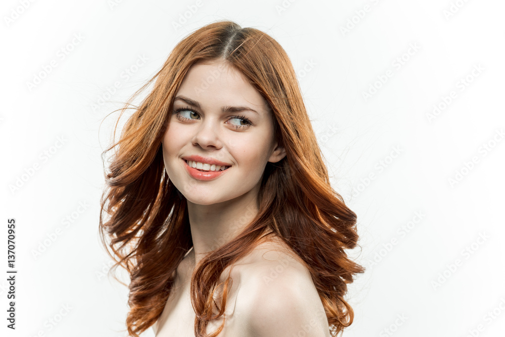 cute red-haired woman on a light background cute red-haired woman on a light background