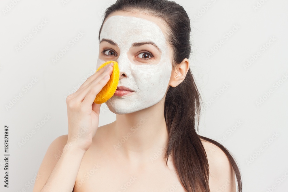 adorable woman with a sponge near the face adorable woman with a sponge near the face