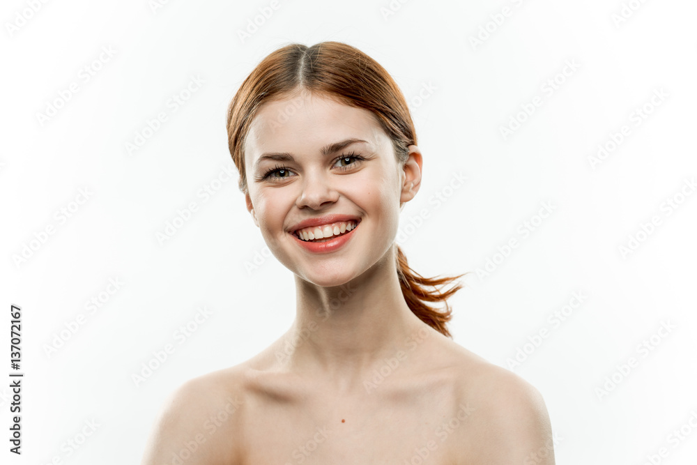 cheerful woman smiling on a light background cheerful woman smiling on a light background