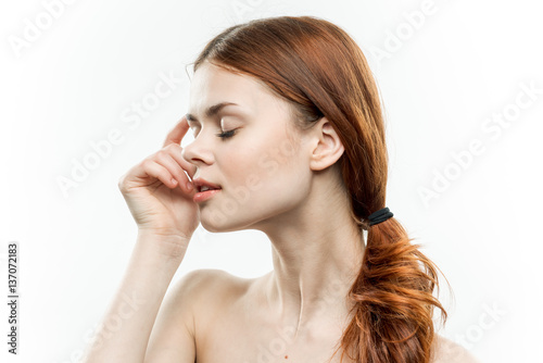 woman with closed eyes and bare shoulders