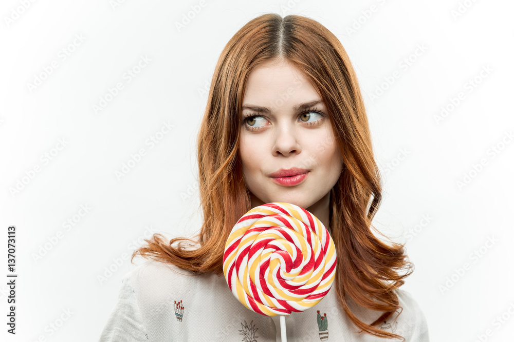 round lollipop in woman's hand