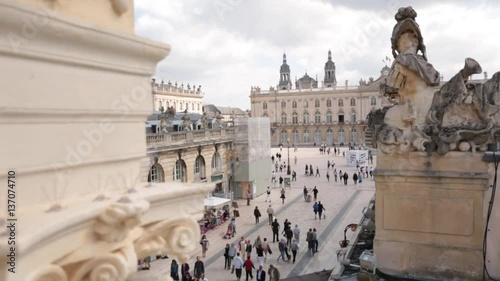 Groups of people on the Place Stanislas seen from the Porte Héré, Nancy, France