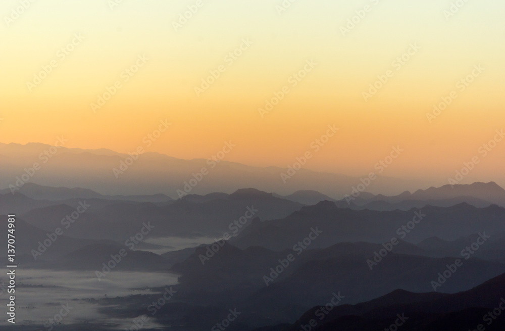 Morning sun and fog on the mountain