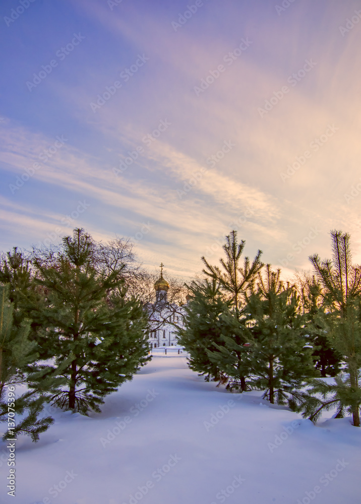 Winter sunset landscape with colorful sky and white Cathedral in