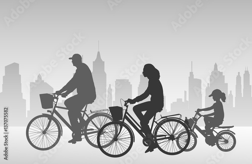 family riding bicycles silhouettes - vector