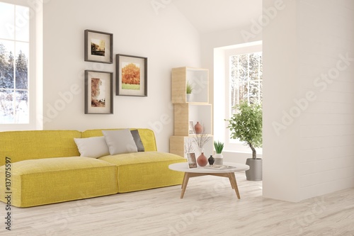 White interior design with sofa and winter landscape in window © AntonSh