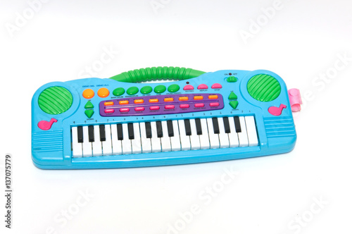 Children toy piano and microphone  on white background.