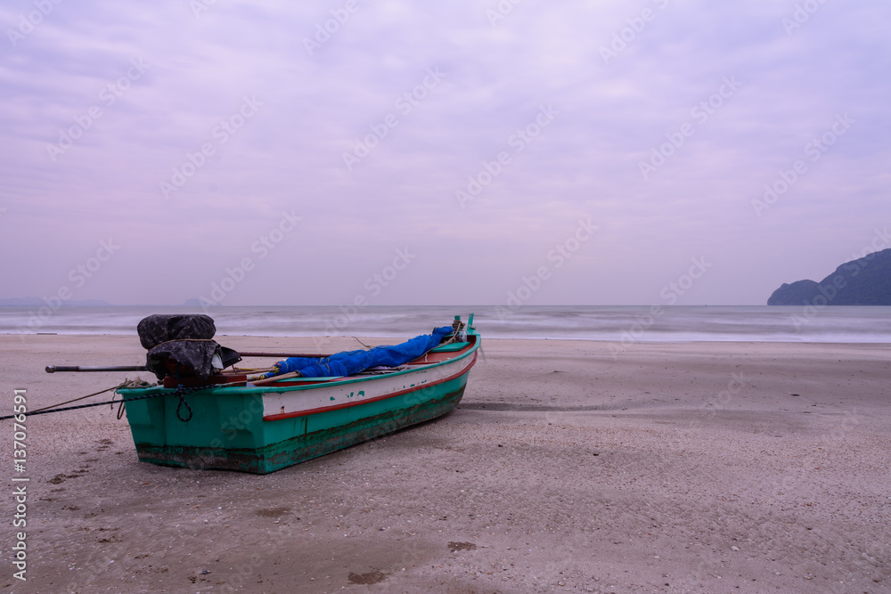 wooden boat on the beach and couldy sky wooden boat on the beach and couldy sky