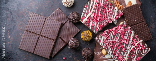 Tableau sur toile Stack of chocolate bars and praline truffle