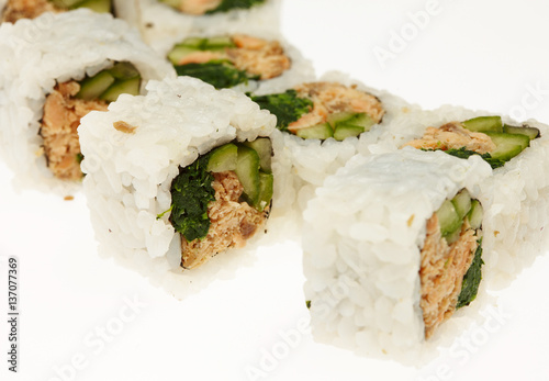 Roll sushi on a plate isolated on white background.